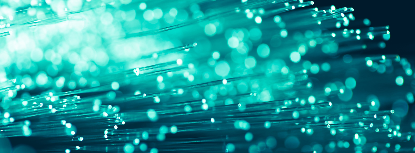 A picture of lights and fibre optic cables, representing business internet