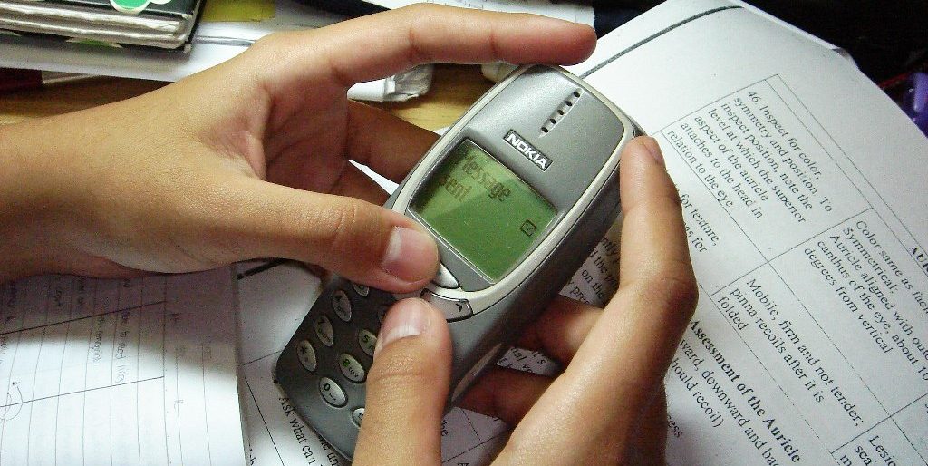 Picture of a Nokia 3310 handset in the hands of a person